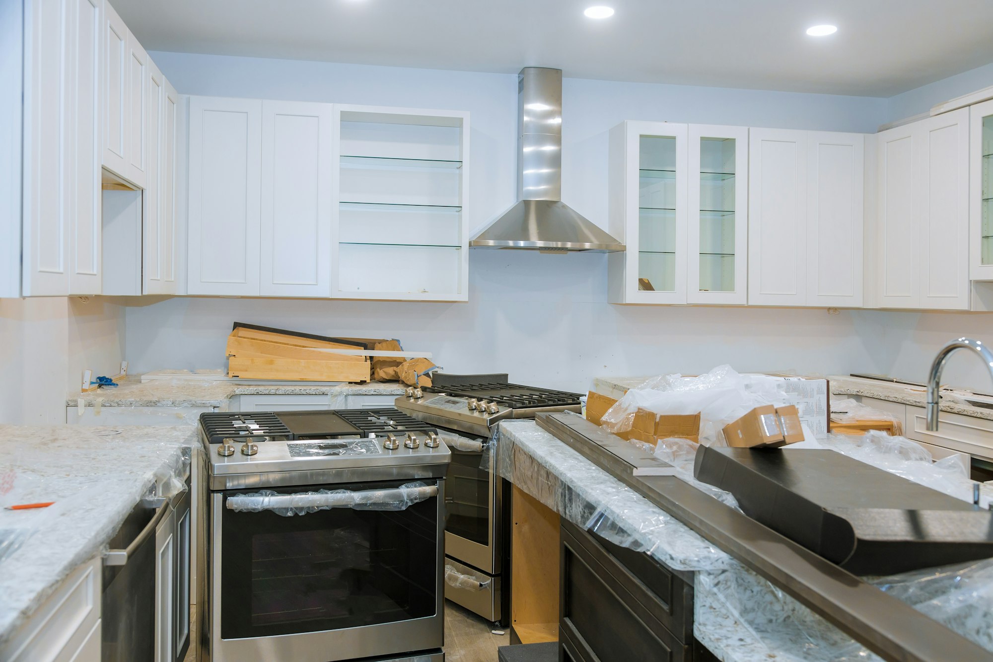 Interior of modern kitchen with all appliances on stove top